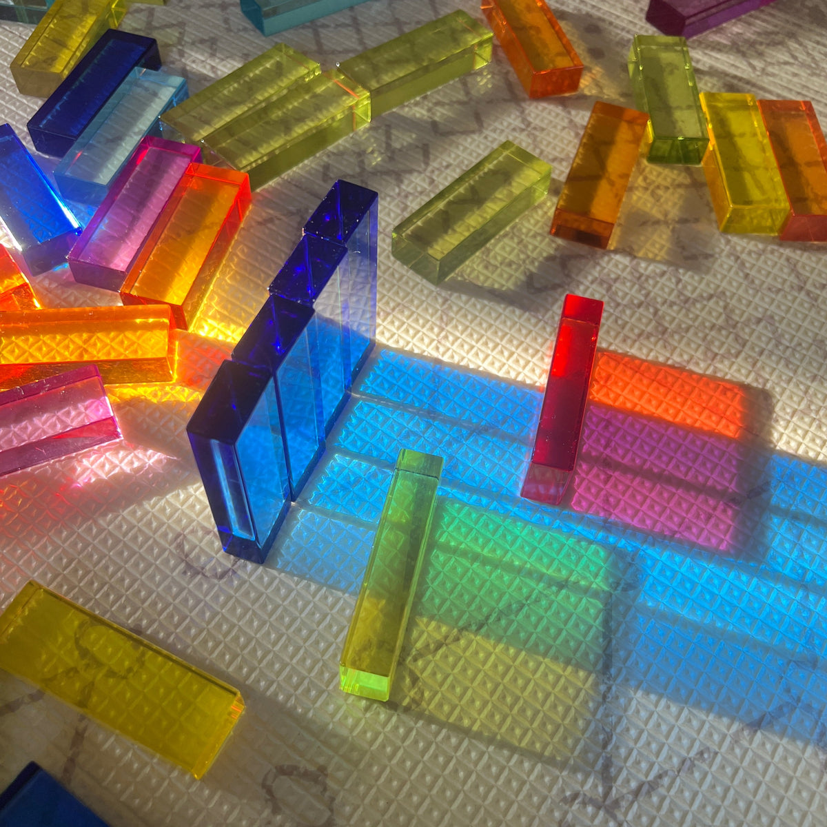 Newton's Tower blocks catching the light in vibrant spectrum colours
