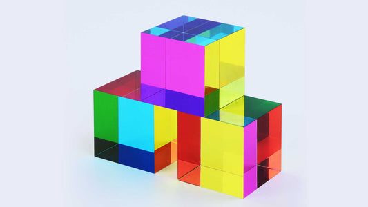 Three translucent CMY Cubes stacked together, showing overlapping colours